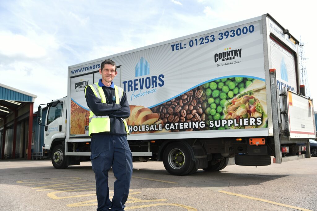 Staff member behind Trevors Foodservice Van